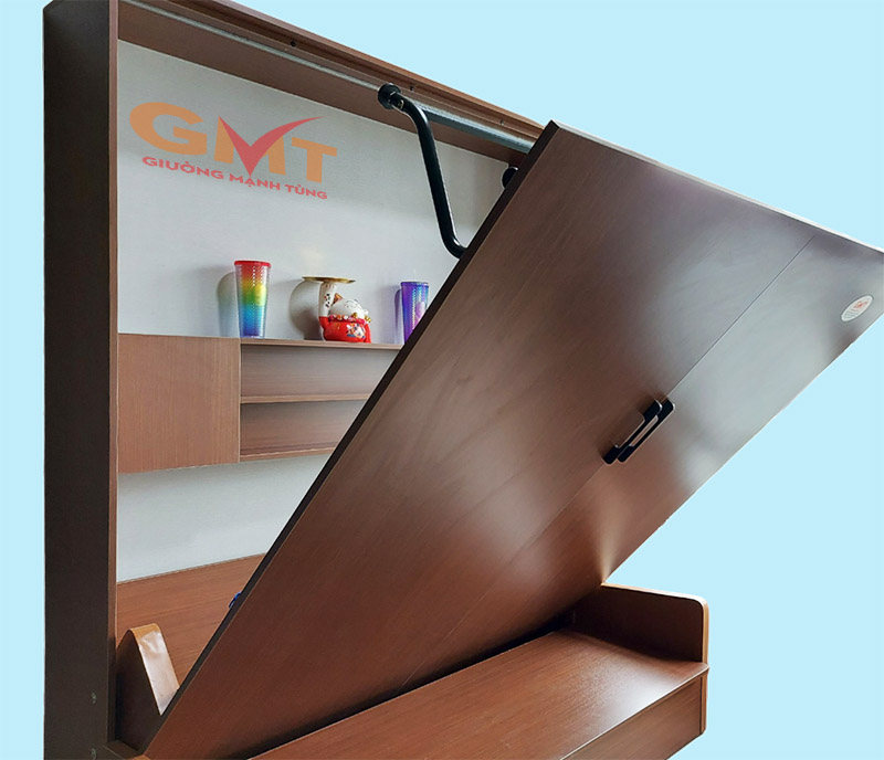  Hình ảnh cận cảnh giường gấp thông minh Mạnh Tùng đang được mở, làm nổi bật hệ thống trợ lực bằng lò xo màu đen.